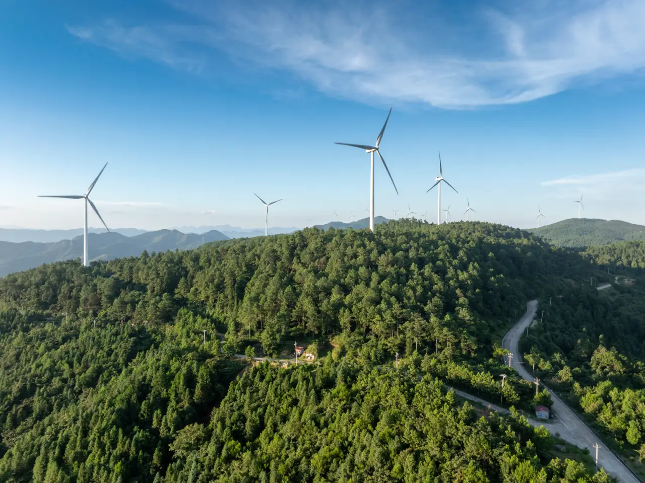wind-power-generation-on-forest-mountain-top.webp